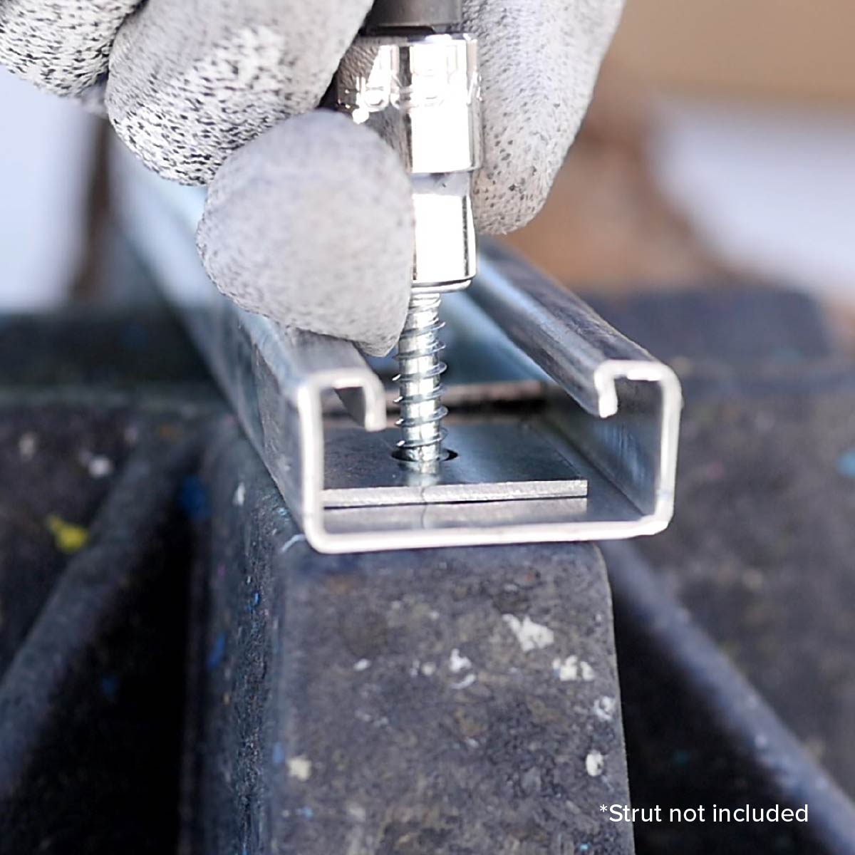 Drilling holes in saddle pipe support to attach strut